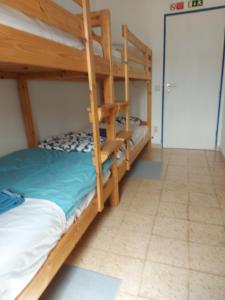 a bunk bed room with two bunk beds in it at Agua de Sonho 2 in Bensafrim