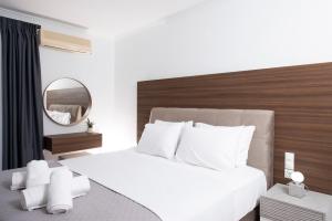 Postel nebo postele na pokoji v ubytování MY PHOS Boutique Apartments