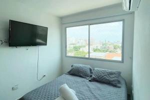 Cama o camas de una habitación en Cozy duplex with balcony, pool and great location