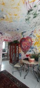 a room with a painting of a heart on the wall at Multitudenow in Florianópolis