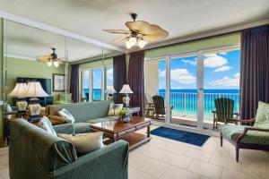 a living room with a view of the ocean at Beachfront Bliss Luxe 3BR Condo at Marisol Complex in Panama City Beach