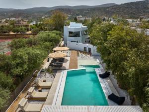 an aerial view of a house with a swimming pool at MichELe Luxury apartments by Smaris Collection in Malia