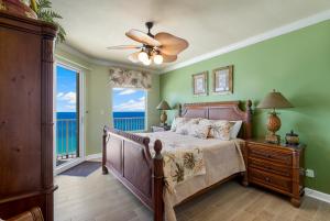 a bedroom with a bed and a large window at Beachfront Bliss Luxe 3BR Condo at Marisol Complex in Panama City Beach +35 photos