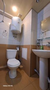 a bathroom with a toilet and a sink at Best apartments in downtown in Yerevan