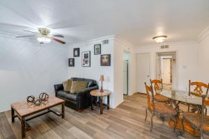 a living room with a couch and a table at 4 Mi to Dtwn Dallas Condo with Pool Access! in Dallas