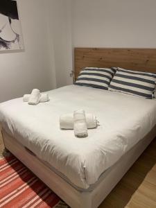 a large bed with towels on it in a bedroom at Marbella Le Normandy in Marbella