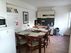 a kitchen and dining room with a table and chairs at Penzion Janata in Slapy