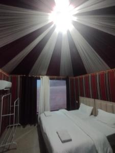 a bedroom with a bed in a tent at Waid Rum Jordan Jordan in Wadi Rum