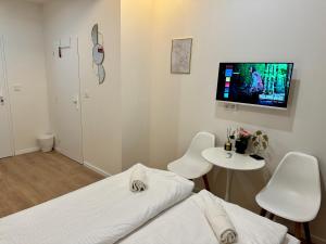 TV a/nebo společenská místnost v ubytování Zitna Downtown Apartments