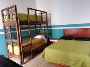 Postel nebo postele na pokoji v ubytování Casa Veeyuu