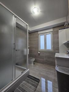 Kylpyhuone majoituspaikassa Apartments Bonis III