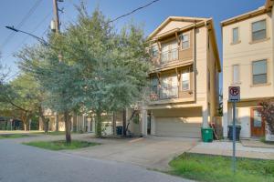 a apartment building with a tree in front of it at Pet-Friendly Houston Home about 7 Mi to Downtown! in Houston