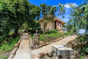 a house on the side of a hill with trees at Adere Safari lodge 