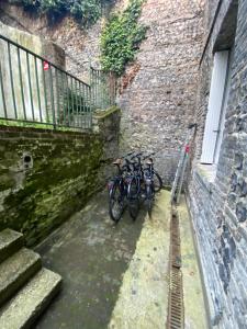 two bikes are parked next to a building at Arina & Julien Dieppe in Dieppe