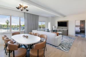 a living room with a couch and a table at The Westin Sacramento in Sacramento