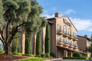 a building with a wissota sign on it at Westin Sacramento in Sacramento