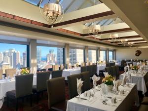 a dining room with tables and chairs and tablesktop at Marines' Memorial Club & Hotel Union Square in San Francisco