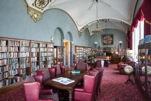 a library with chairs and a table and books at Marines' Memorial Club & Hotel Union Square in San Francisco