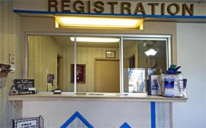 a waiting room with a reflection in the window at Americas Best Value Inn - Roxboro in Roxboro