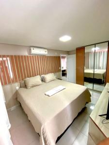 Ένα ή περισσότερα κρεβάτια σε δωμάτιο στο Residencial renaissance