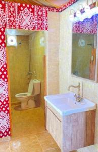 a bathroom with a sink and a toilet in it at Wadi rum moon camp in Disah