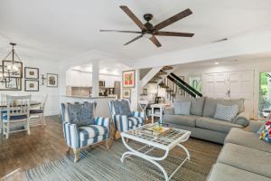 a living room with a couch and a table at 2009 Beach Wood in Amelia Island