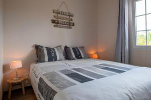 Ένα ή περισσότερα κρεβάτια σε δωμάτιο στο Masbango Beach Resort