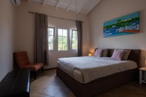 Ένα ή περισσότερα κρεβάτια σε δωμάτιο στο Masbango Beach Resort