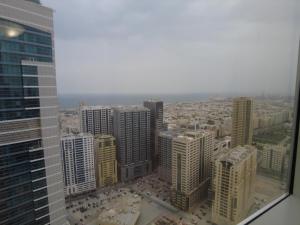 an aerial view of a city with tall buildings at إمارة الشارقة منطقة الخان شقة مفروشة غرفتين و صالة أجار 15 يوم أو شهر in Al Khān