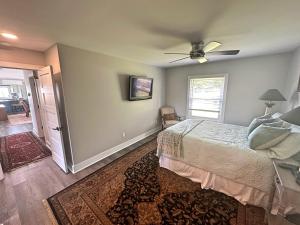 a bedroom with a bed and a ceiling fan at 2-Bedroom 2-Bath Cozy Home in Nashville's Vibrant in Nashville