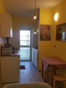 A kitchen or kitchenette at Le terrazze di Alberto