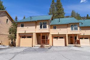 a house with two garages and two garage doors at 593 New June Lake Condo in June Lake