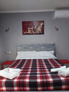 Postel nebo postele na pokoji v ubytování GEX Guest House