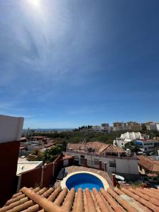 a view from the roof of a building with a swimming pool at Luxury villa in the heart of the city of Marbella Spain. in Marbella