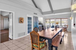 a dining room with a wooden table and chairs at Lake Silver Retreat lll in Winter Haven