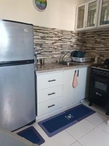 Virtuvė arba virtuvėlė apgyvendinimo įstaigoje Acogedor apartamento Verón Punta Cana