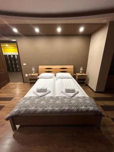 Ένα ή περισσότερα κρεβάτια σε δωμάτιο στο IANIS Apartment