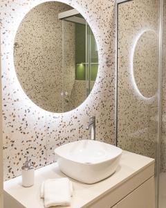 a bathroom with a sink and a mirror at Harmony Luxury 2 in Ierápetra +37 photos