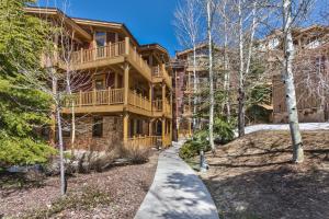 a home with a walkway in front of it at Enjoy High End Appliances, Private Hot Tub & Amazing Views at Deer Valley Black Bear Penthouse B! in Park City
