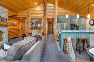 a living room and kitchen in a log cabin at Luxury Condo Near Year-Round Recreation, Free Shuttle & Hot Tub! Deer Valley Comstock Lodge 302 in Park City