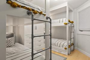a bunk bed room with two bunk beds at Enjoy a Modern Luxury Design, Central Location, Hot Tub & Recreation! Deer Valley Fawngrove 1674 in Park City