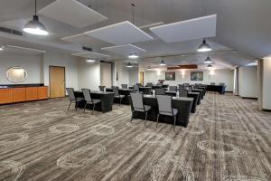 a conference room with chairs and a podium in it at Drury Inn & Suites San Antonio Northwest Medical Center in San Antonio +60 photos
