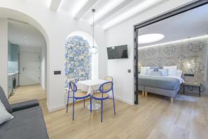 Letto o letti in una camera di GRAN VIA capitals by MONARO*****