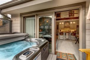 a hot tub in the backyard of a house at Enjoy a Modern Luxury Design, Central Location, Hot Tub & Recreation! Deer Valley Fawngrove Estate in Park City