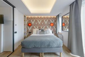Letto o letti in una camera di GRAN VIA capitals by MONARO*****