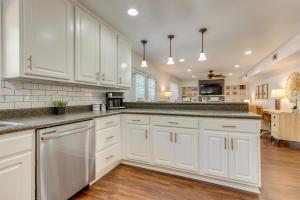 a kitchen with white cabinets and a counter top at Family-Friendly Home 6 Mi to Downtown Mobile! in Mobile
