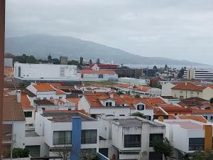 a view of a city with roofs and buildings at Paim Maria in Ponta Delgada
