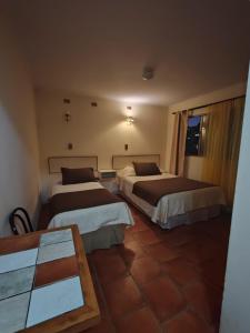 Hotel Brasil tesisinde bir odada yatak veya yataklar