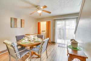 a dining room with a table and chairs and a ceiling fan at Convenient Harvey Apt - 12 Mi to French Quarter! in Harvey