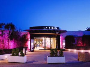 a store front with pink lights in front of it at Séjour sur voilier in Antibes